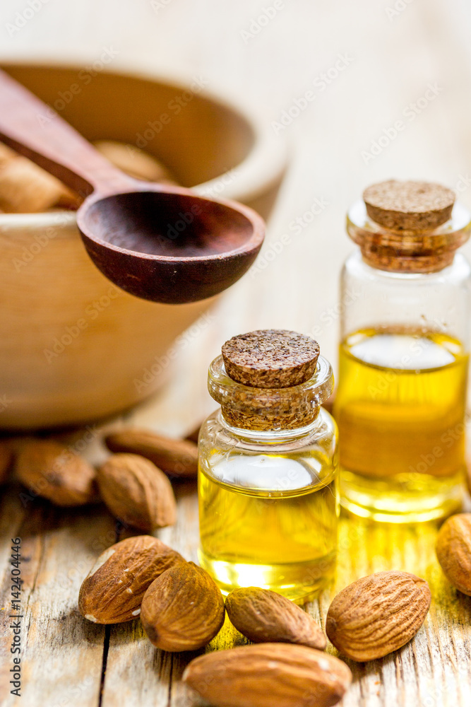 organic cosmetic with almond extract on table background organic cosmetic with almond extract on table background