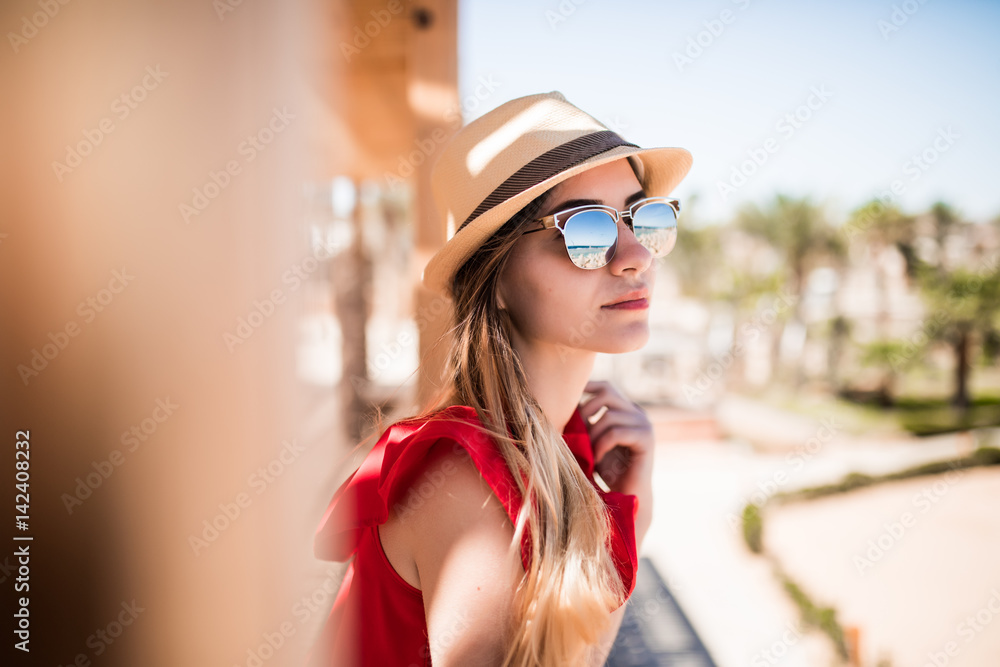 Portrait of sunny girl relaxing on summer sun wearind in hat and sunglasses. Summer vocation. Portrait of sunny girl relaxing on summer sun wearind in hat and sunglasses. Summer vocation.