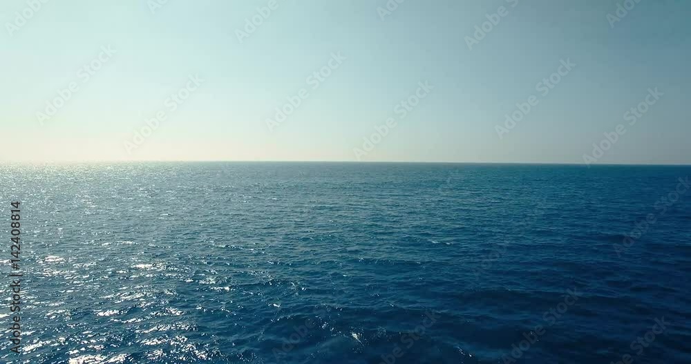 Aerial view flying on drone, over ocean.