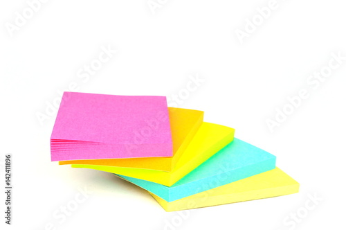 Pile of sticky notes on a stair format isolated on white background