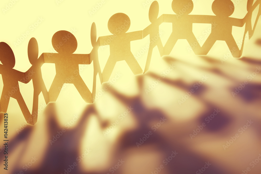Paper chain people in a row holding hands. Team, teamwork concepts. Paper chain people in a row holding hands. Team, teamwork concepts.