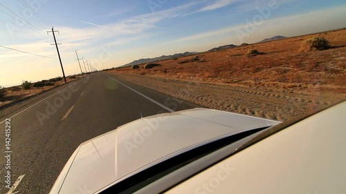 Car driving off in the desert. GoPro camera attached on car's ceiling while driving on desert road
