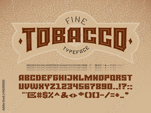 Decorative vintage font on the background of the texture of the tobacco leaf