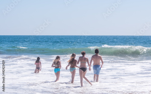 People are enjoying summer time on the beaches along Pacific ocean