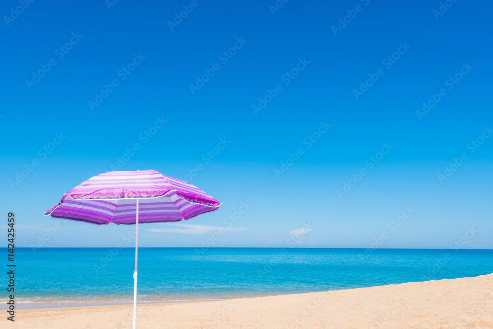 Violet parasol , purple umbrella on the beach
