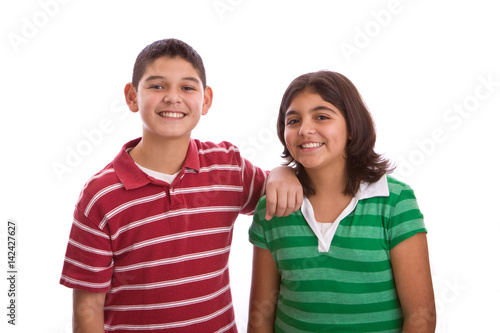 Happy Hispanic brother and sister isolated on white.