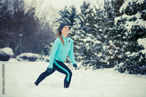 Winter sport  girl exercising in park