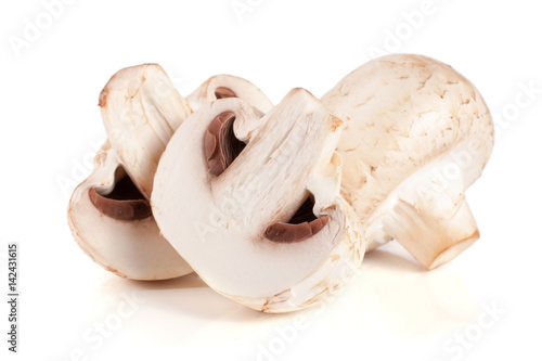champignon mushrooms and half isolated on white background