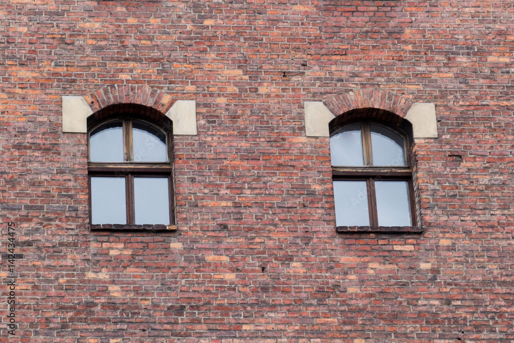 Window on the brick facade of an old house Window on the brick facade of an old house