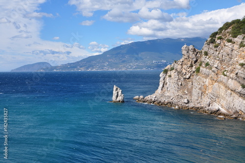 Rock in the blue ocean