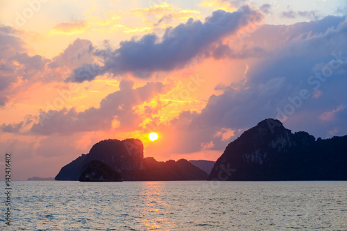 Spectacular sunrise over sea and mountains   