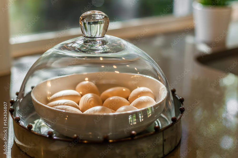 eggs under glass dome foto de Stock Adobe Stock