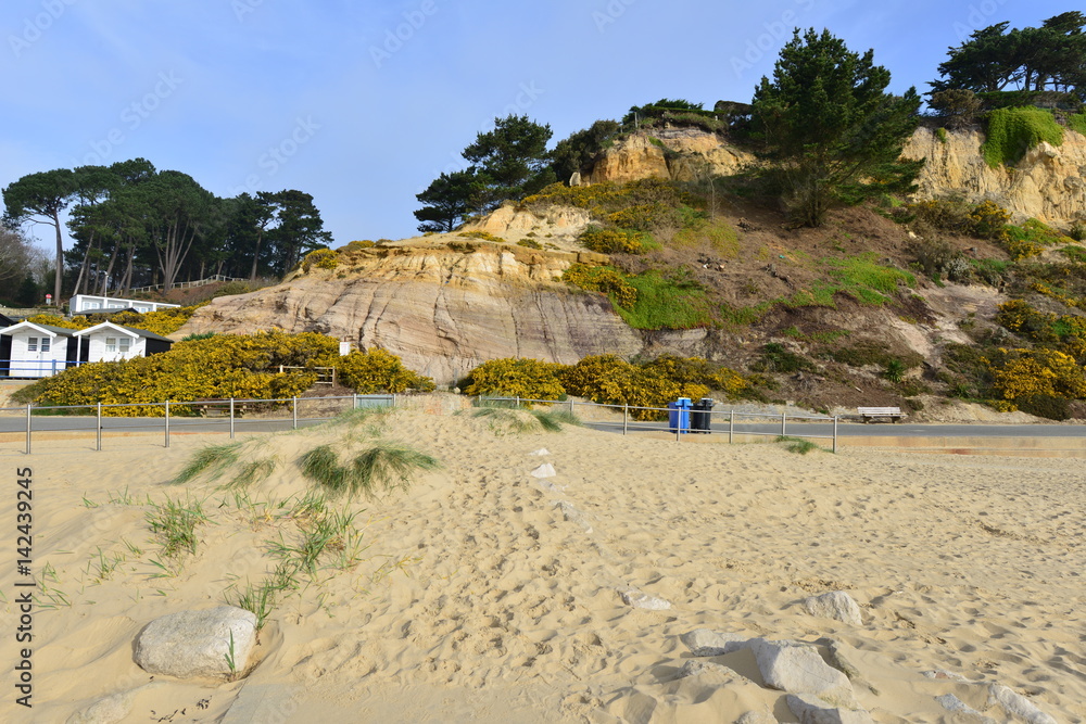 Branksome Chine beach at Bournemouth in Dorset on a spring morning, light cloud occasional sunshine.
