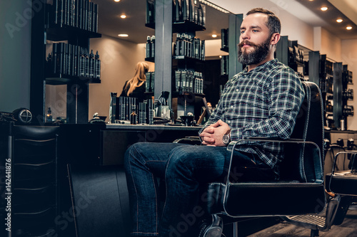 Portrait of handsome casual male in a barbershop.