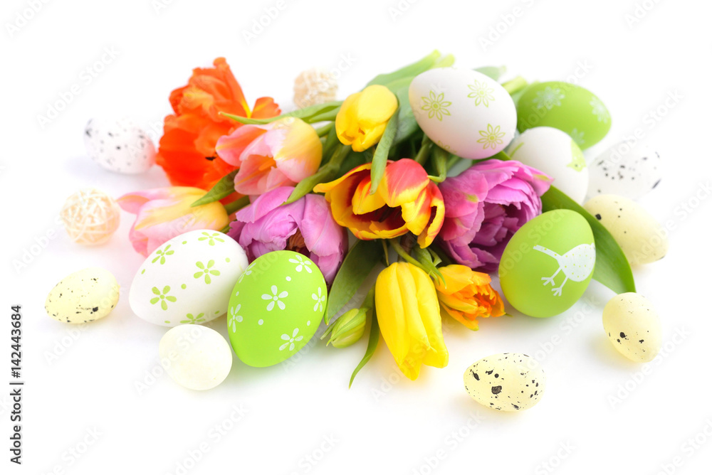 Easter eggs with tulips flowers on white background