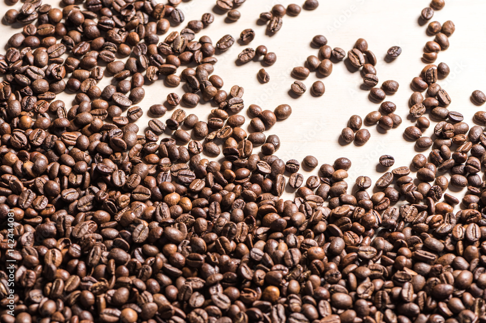 Top view of roasted coffee beans on white background Top view of roasted coffee beans on white background