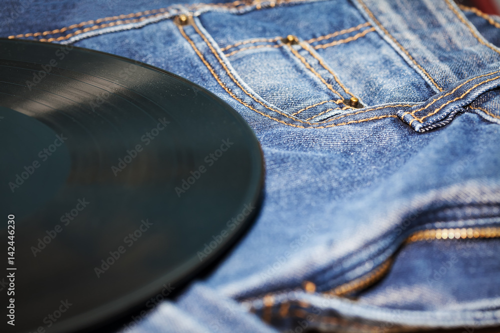 vinyl disk and jeans