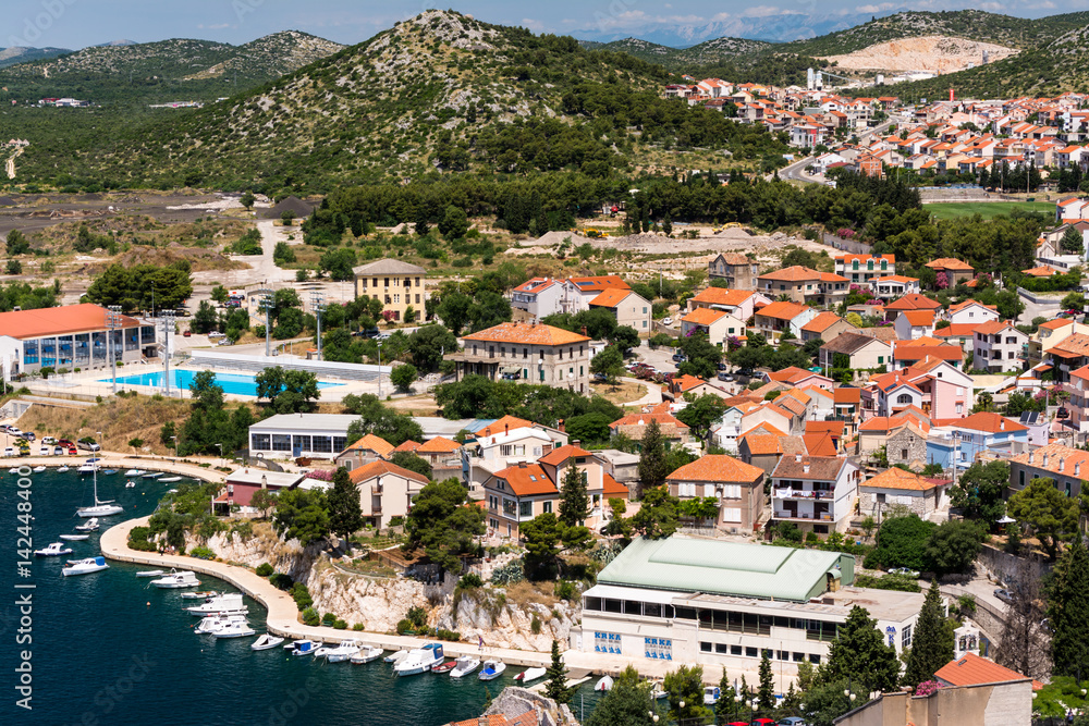 Birds view of the bay of adriatic resort Shibenic. Yachts in harbor and red roofs of houses, of old mediterranean town.