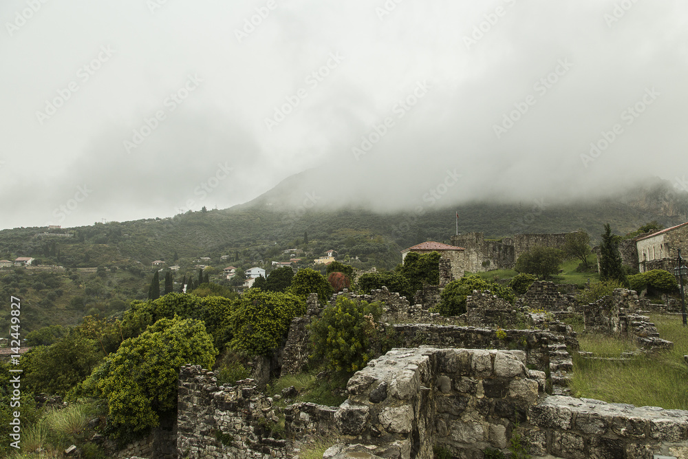 Fototapeta premium Montenegro The city of Old Bar. Low clouds sat on the tops of mountains, promising a quick downpour. All of nature grew silent and settled down to the storm.