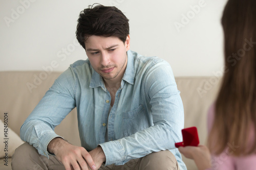Canvas-taulu Initiative woman making marriage proposal to boyfriend, returning box with engag