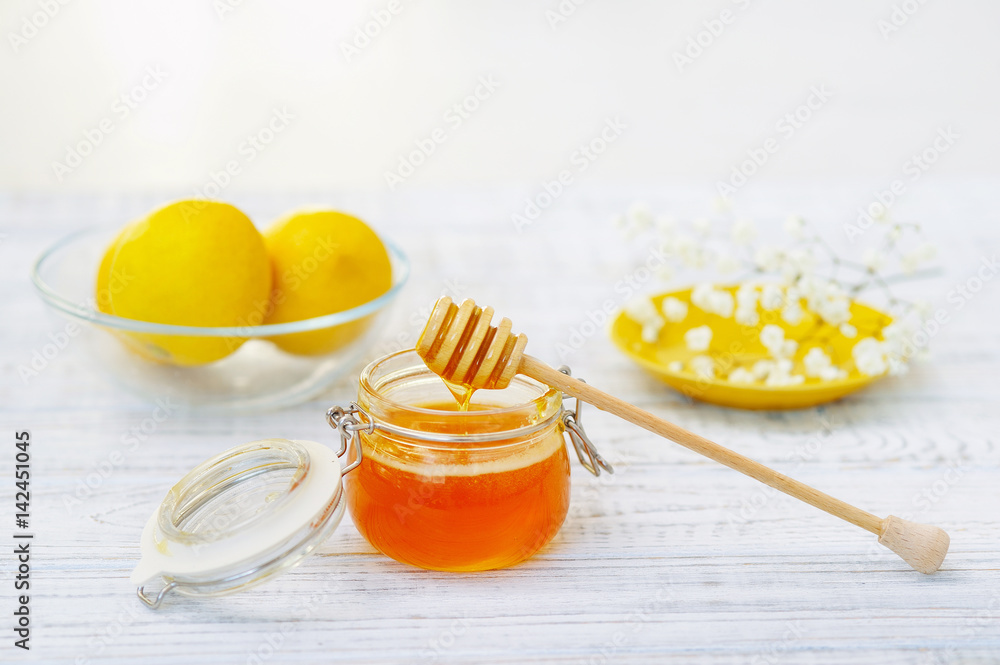 Still life with honey and lemons, healthy organic food Still life with honey and lemons, healthy organic food