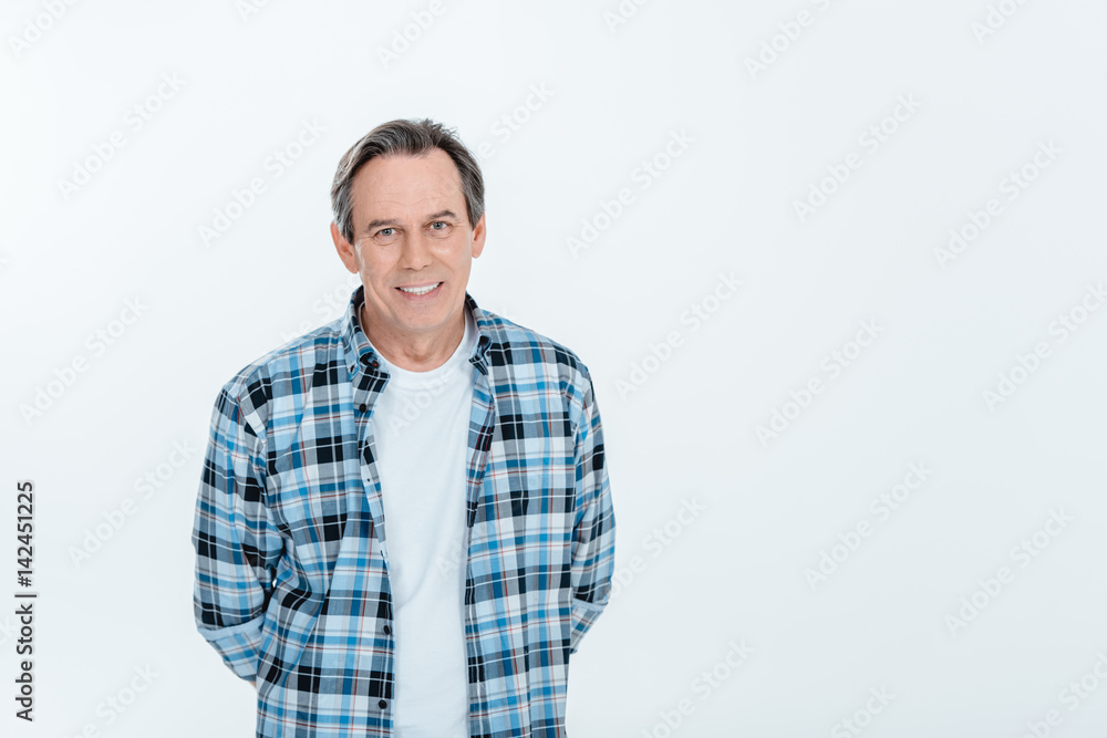Front view of middle aged handsome man smiling on white with copy space Front view of middle aged handsome man smiling on white with copy space