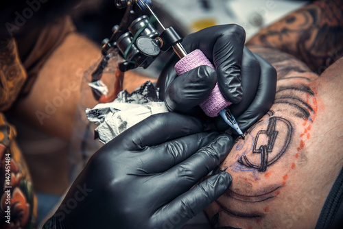 Tattoo artist create tattoo in studio