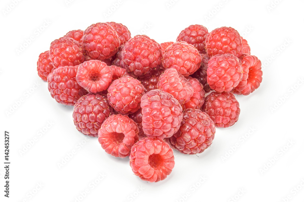 Heart shaped red raspberries isolated on white Heart shaped red raspberries isolated on white