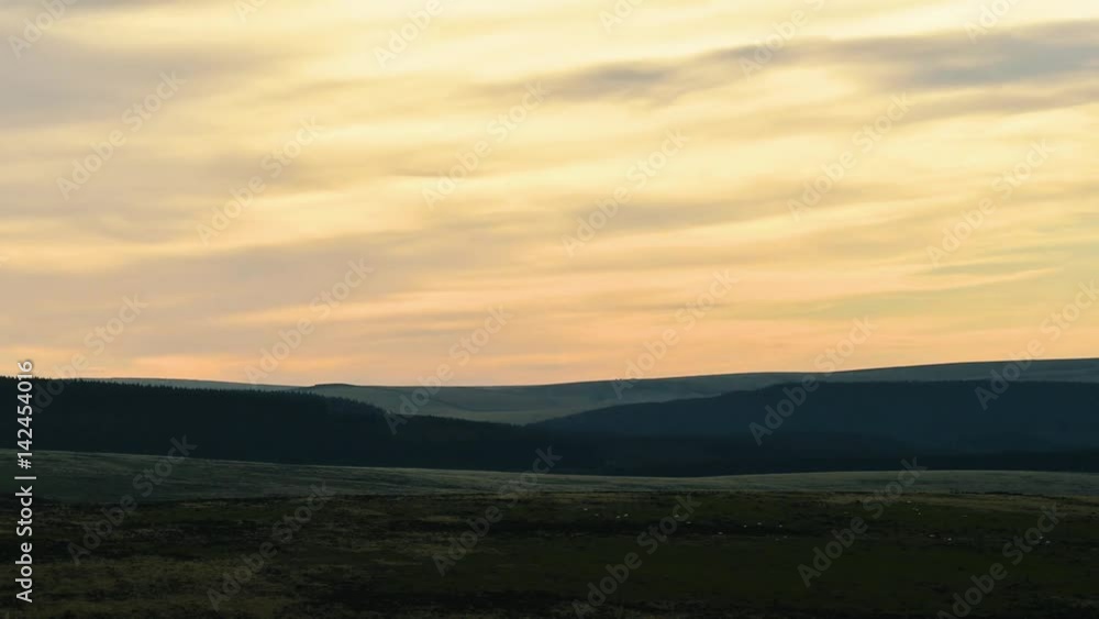 Sunset over Dartmoor National Park time lapse. Setting sun with flock of sheep over Dartmoor Forest on misty evening in National Park in Devon, England, UK
Sunset over Dartmoor National Park time lapse. Setting sun with flock of sheep over Dartmoor Forest on misty evening in National Park in Devon, England, UK