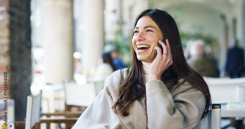 One morning a beautiful elegant woman eats breakfast at the outdoor cafe with a coffee and croissants while calling her friends with the phone and laughs happy.Concept: Breakfast,relax,coffee,business One morning a beautiful elegant woman eats breakfast at the outdoor cafe with a coffee and croissants while calling her friends with the phone and laughs happy.Concept: Breakfast,relax,coffee,business