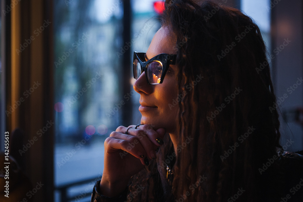 Close-up face portrait of young beautiful woman in Cat's eye glasses in cafe. Romantic concept Close-up face portrait of young beautiful woman in Cat's eye glasses in cafe. Romantic concept