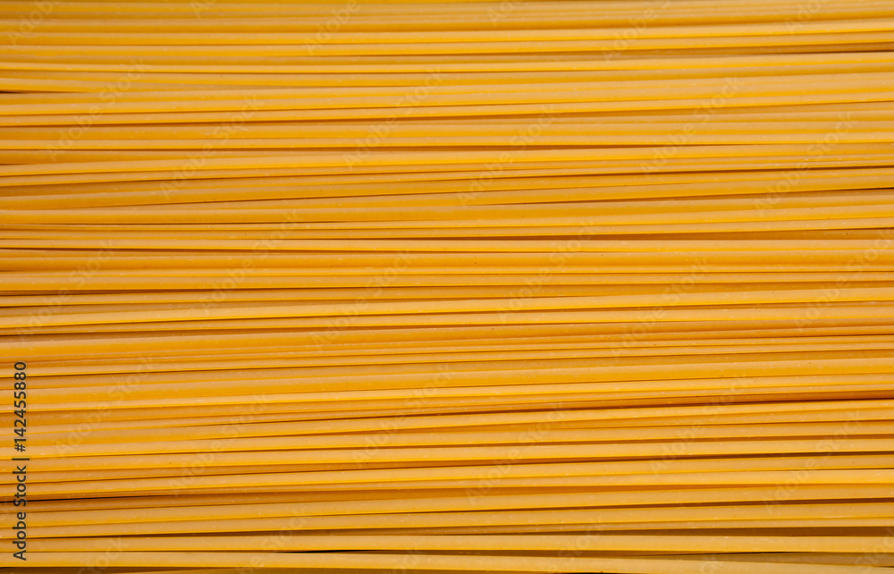 Pile of bavette pasta lying on flat surface Pile of bavette pasta lying on flat surface