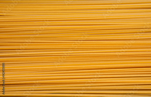 Pile of bavette pasta lying on flat surface