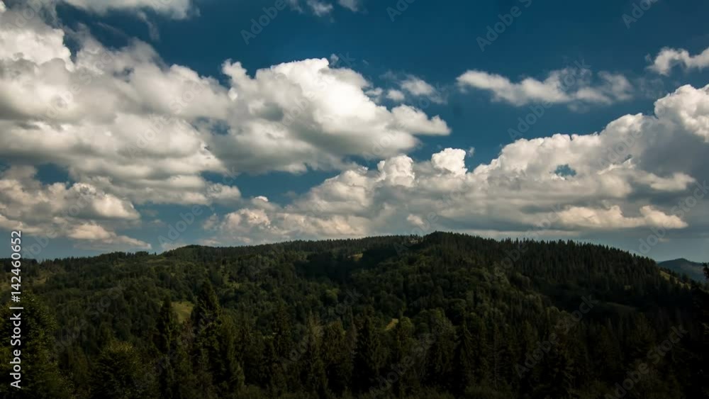 Movement of the twisting of fluffy clouds over the mountains, shadows from clouds on the mountains, incredible breathing of nature, Carpathians, 4K Timelapse footage Movement of the twisting of fluffy clouds over the mountains, shadows from clouds on the mountains, incredible breathing of nature, Carpathians, 4K Timelapse footage