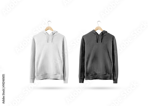 Blank black and white sweatshirt mockup hanging on wooden hanger. Empty sweat shirt mock up on rack isolated. Clear cotton hoody template. Plain textile hoodie design. Loose overall casual jumper.