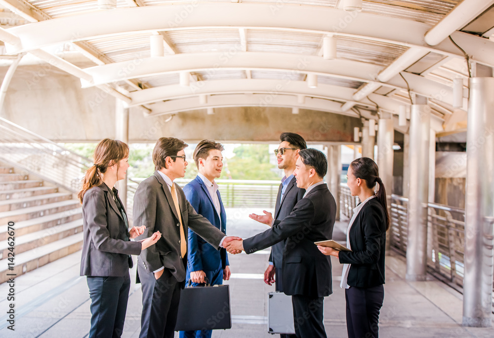 Group of Business people shaking hands,Teamwork finishing up a meetingpartners greeting each other after signing contract and go Seminar Group of Business people shaking hands,Teamwork finishing up a meetingpartners greeting each other after signing contract and go Seminar