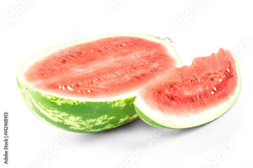 Closeup of watermelon half and slice on white background