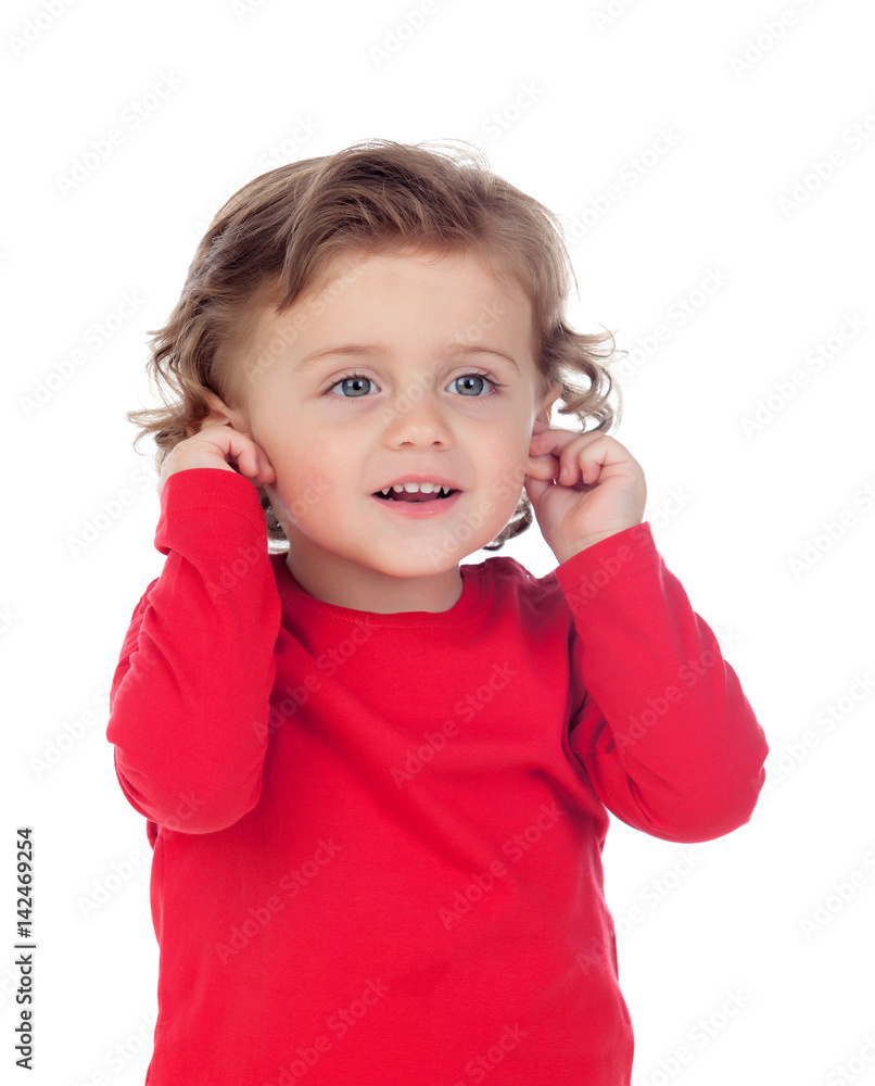 Beautiful little child two years old touching his ears Beautiful little child two years old touching his ears
