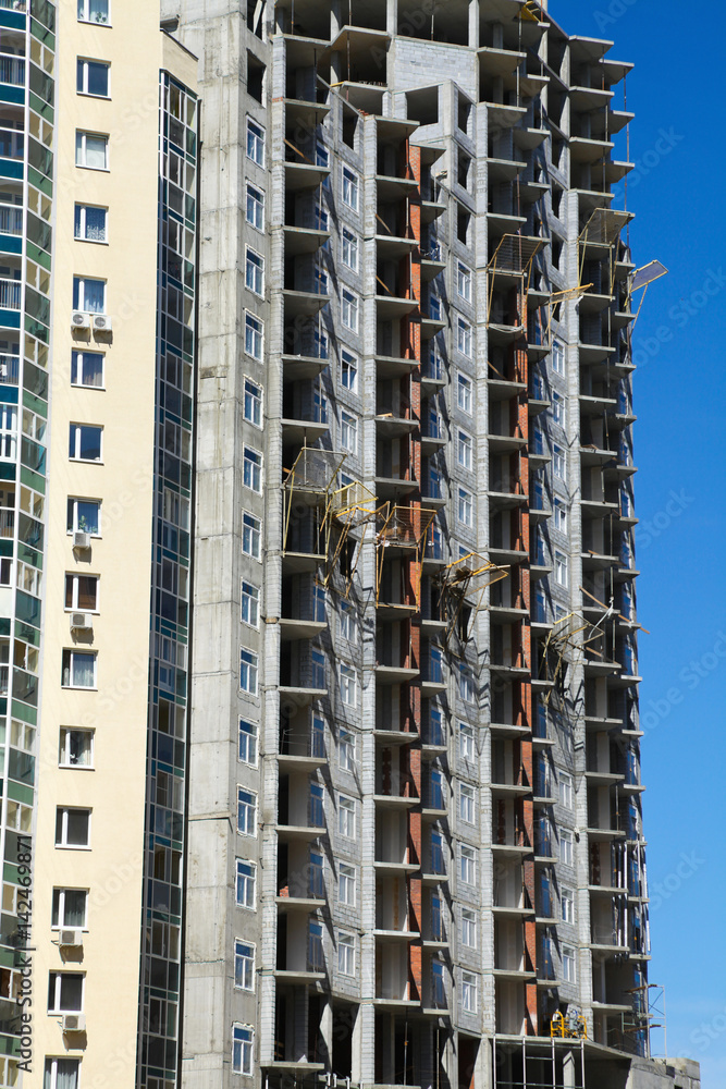 Fototapeta premium multi-storey residential building construction