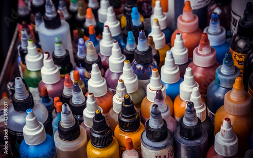 Photos many professional bottles with colored ink for tattoos