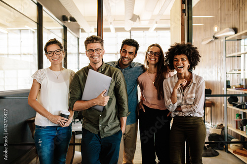 Creative business team laughing together