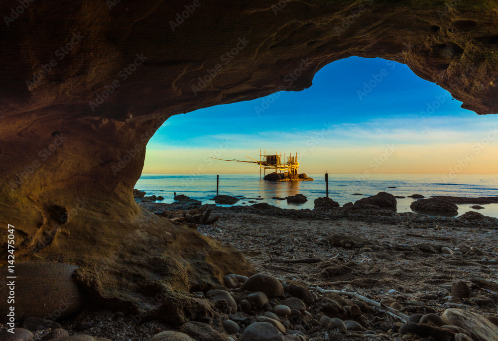Fototapeta premium Punta Aderci, Vasto - Trabocchi Coast in the Abruzzo region (Italy), wooden architecture on the sea at sunrise.
