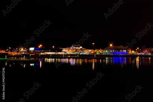 Night fabulous landscape Stockholm harbor, illuminated buildings with reflection in water © Roman