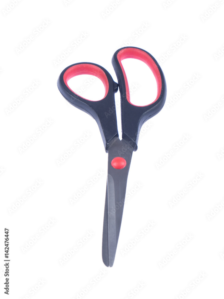 Steel schissors with black and red handle on white ioslated background Steel schissors with black and red handle on white ioslated background