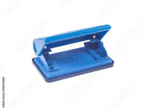 Blue paper punch on white isolated background with sharp focus