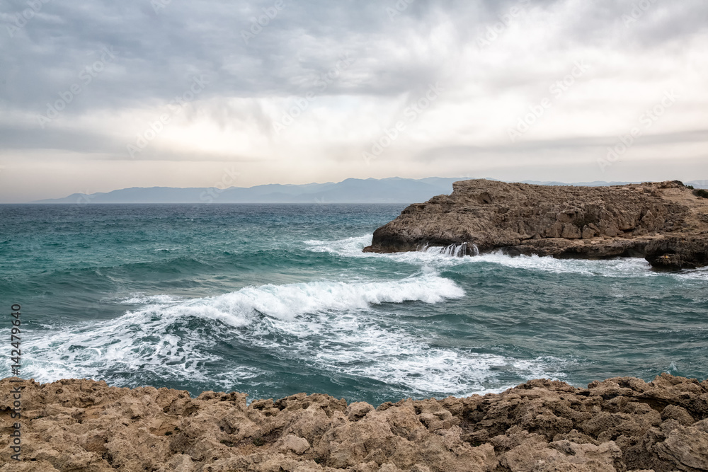Mediterranean Sea waves breaking rocky coastline of Cyprus island