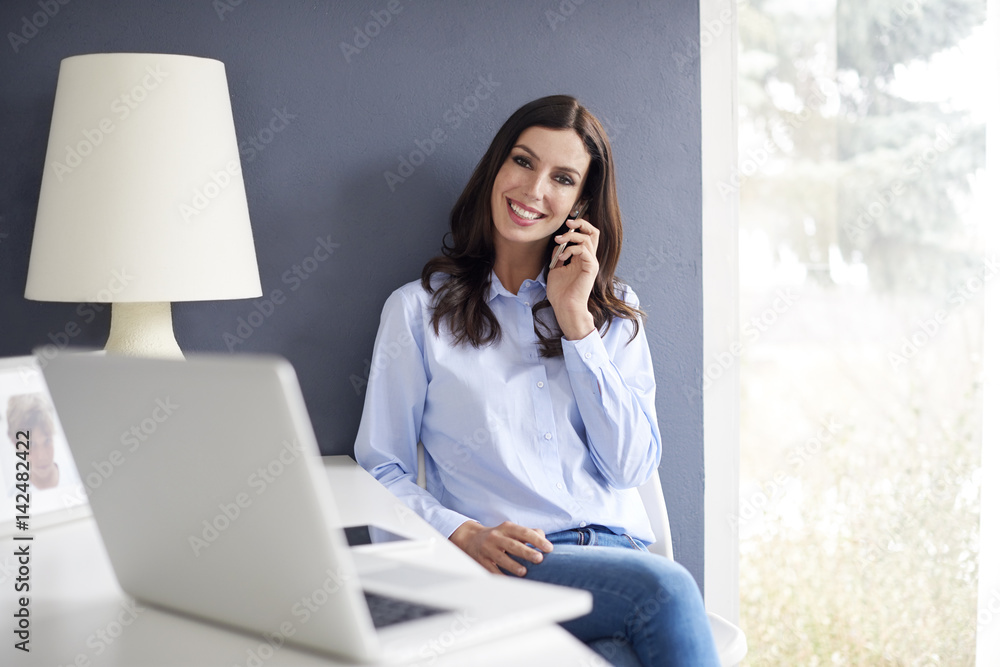 Home office is the best solution. Shot of a thoughtful young woman working on a computer in her home office. Home office is the best solution. Shot of a thoughtful young woman working on a computer in her home office.