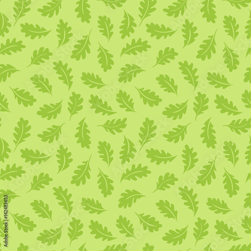 Seamless pattern. Oak leaves on a light green background. It can be used for printing on fabric, wallpaper and wrapping