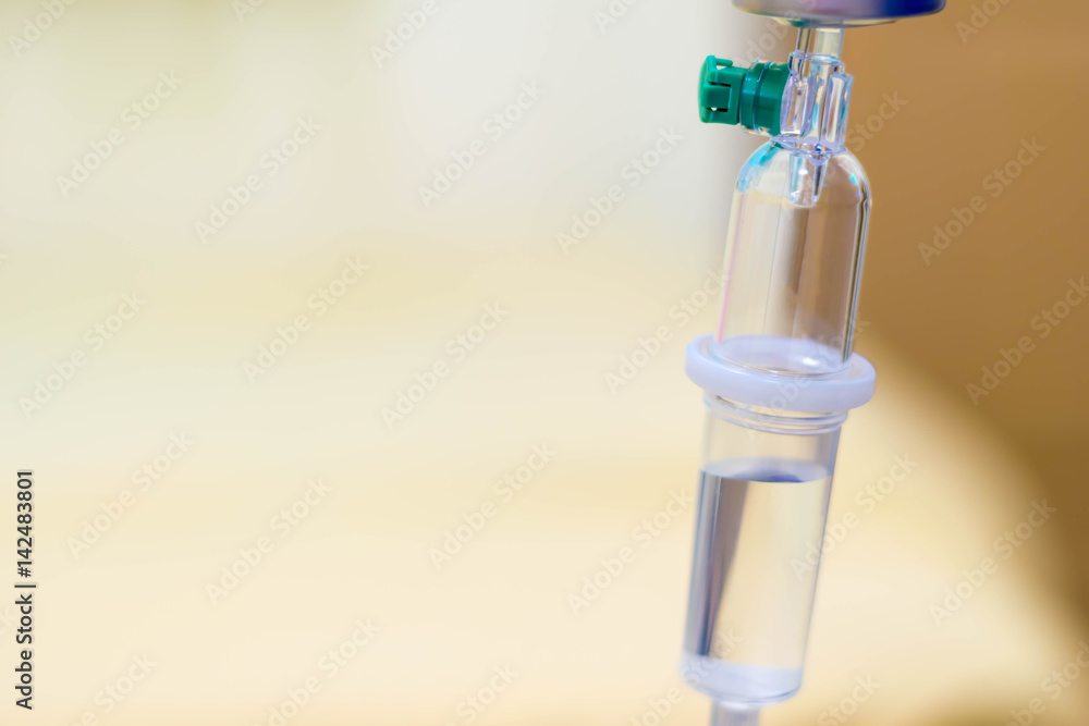 Close up saline intravenous drip for patient. Close up saline intravenous drip for patient.