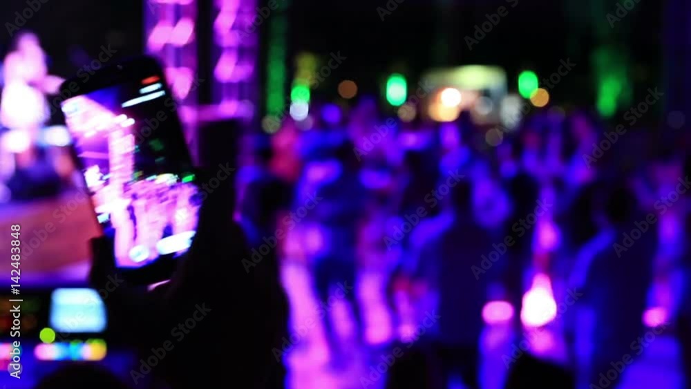record video on smartphone at night club record video on smartphone at night club